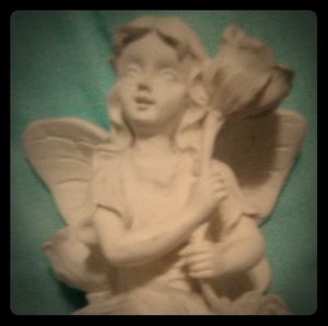 Porcelain Angel w Callilili flower.